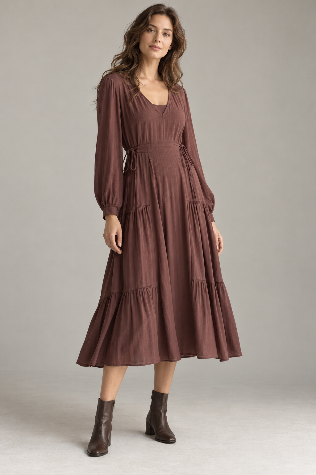 AI-generated design concept of a berry-brown tiered midi dress on a model, not a completed sample
