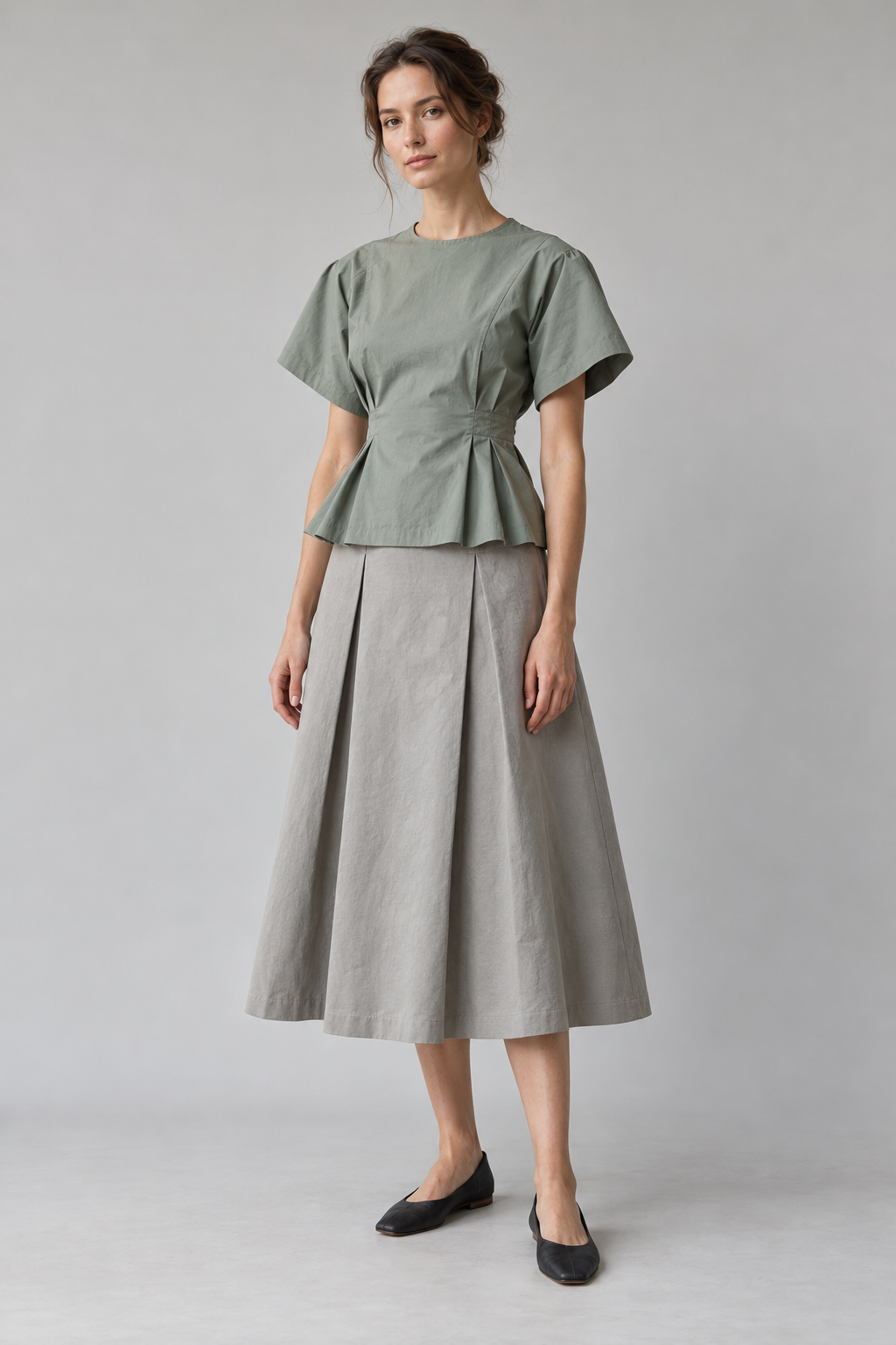 AI-generated design concept of a sage waist-shaped top and stone midi skirt on a model, not a completed sample