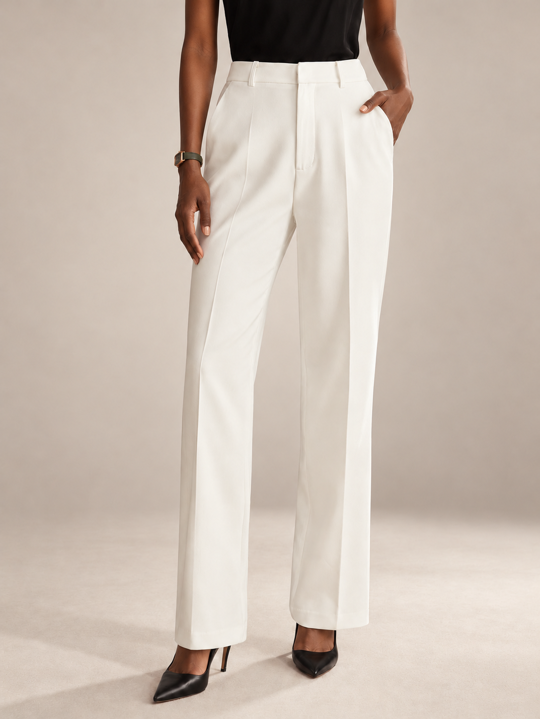 Ivory tailored trousers showing waistband, front crease and leg shape