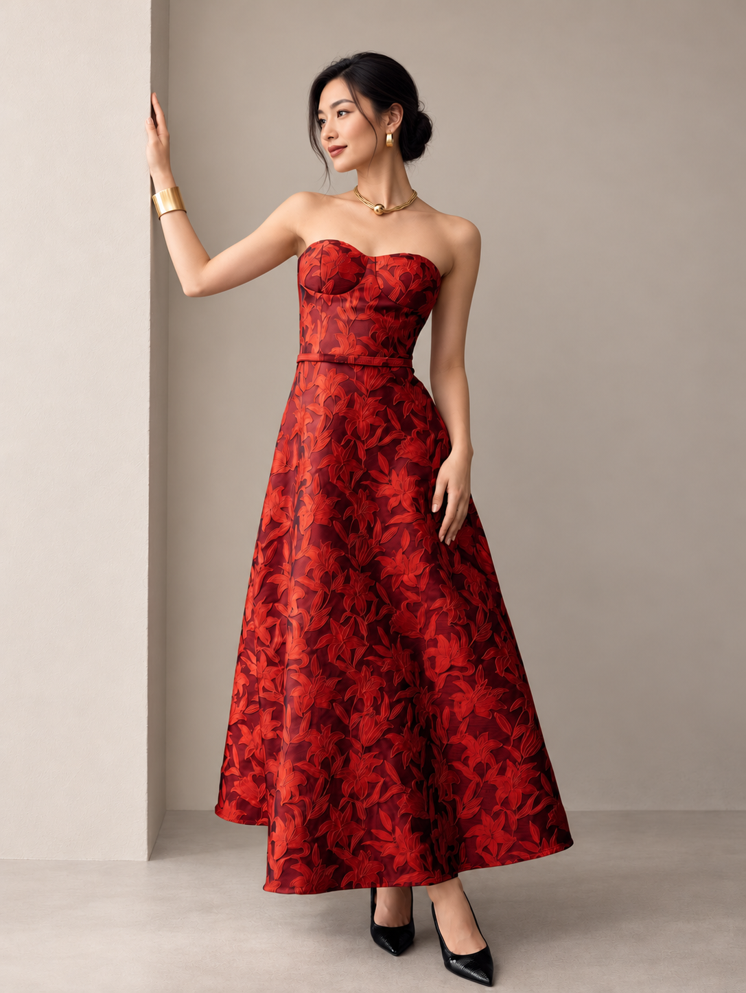 Red floral occasion dress with a shaped strapless bodice on a model